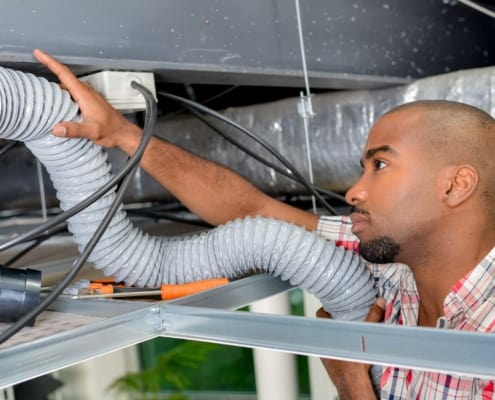 A man stares intently at his venting pipe