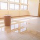 water leak drop interior office building in red bucket from Ceiling and flow on terrazzo floor