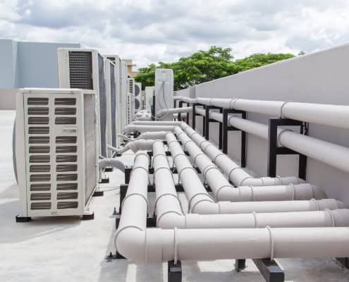 Air conditioning (HVAC) on the roof of an industrial building with blue sky