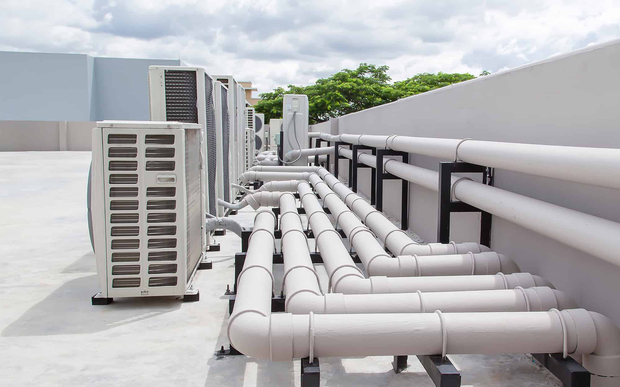 Air conditioning (HVAC) on the roof of an industrial building with blue sky