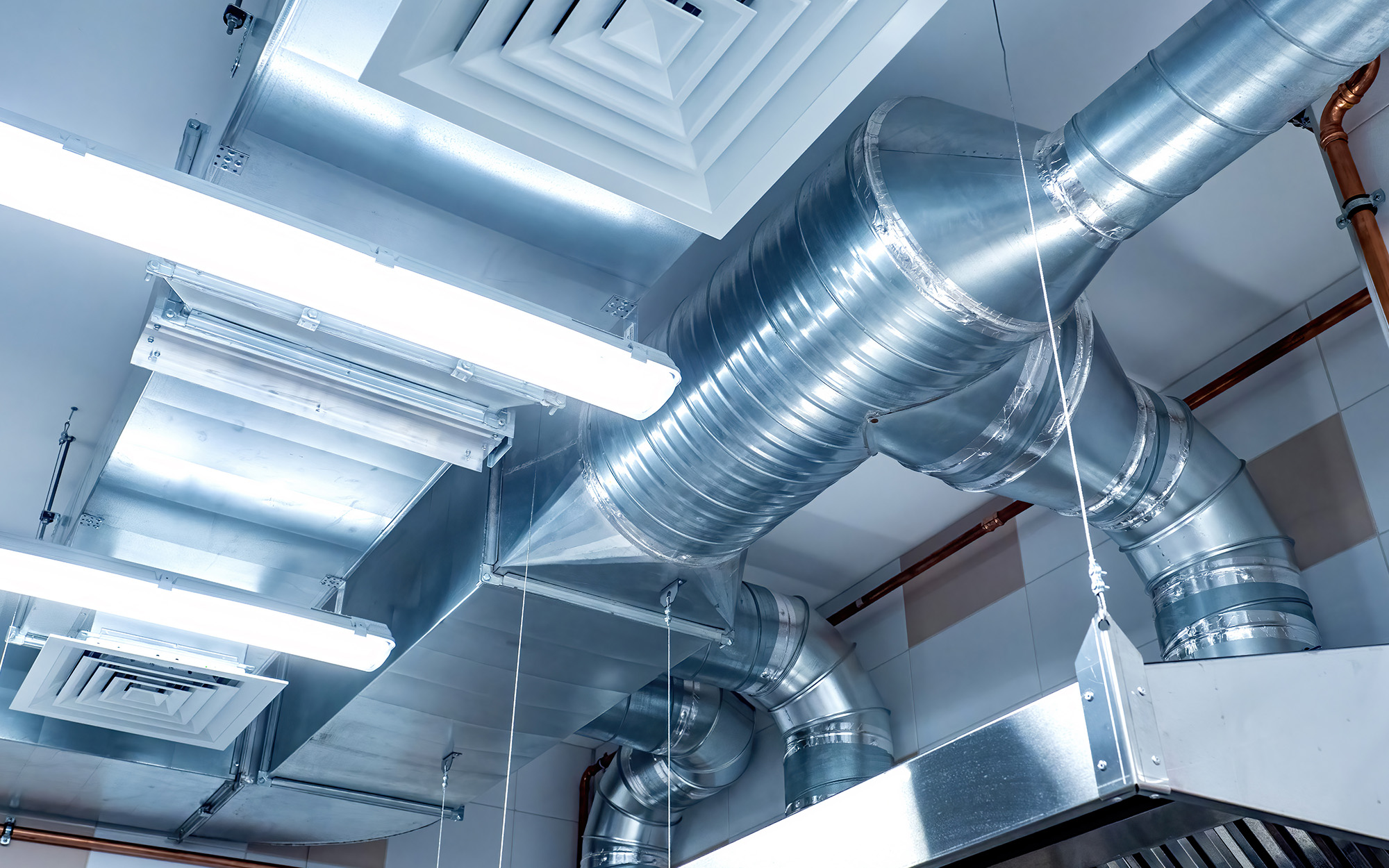 Galvanized pipes with hoods. Ventilation ducts under ceiling, commercial hvac system