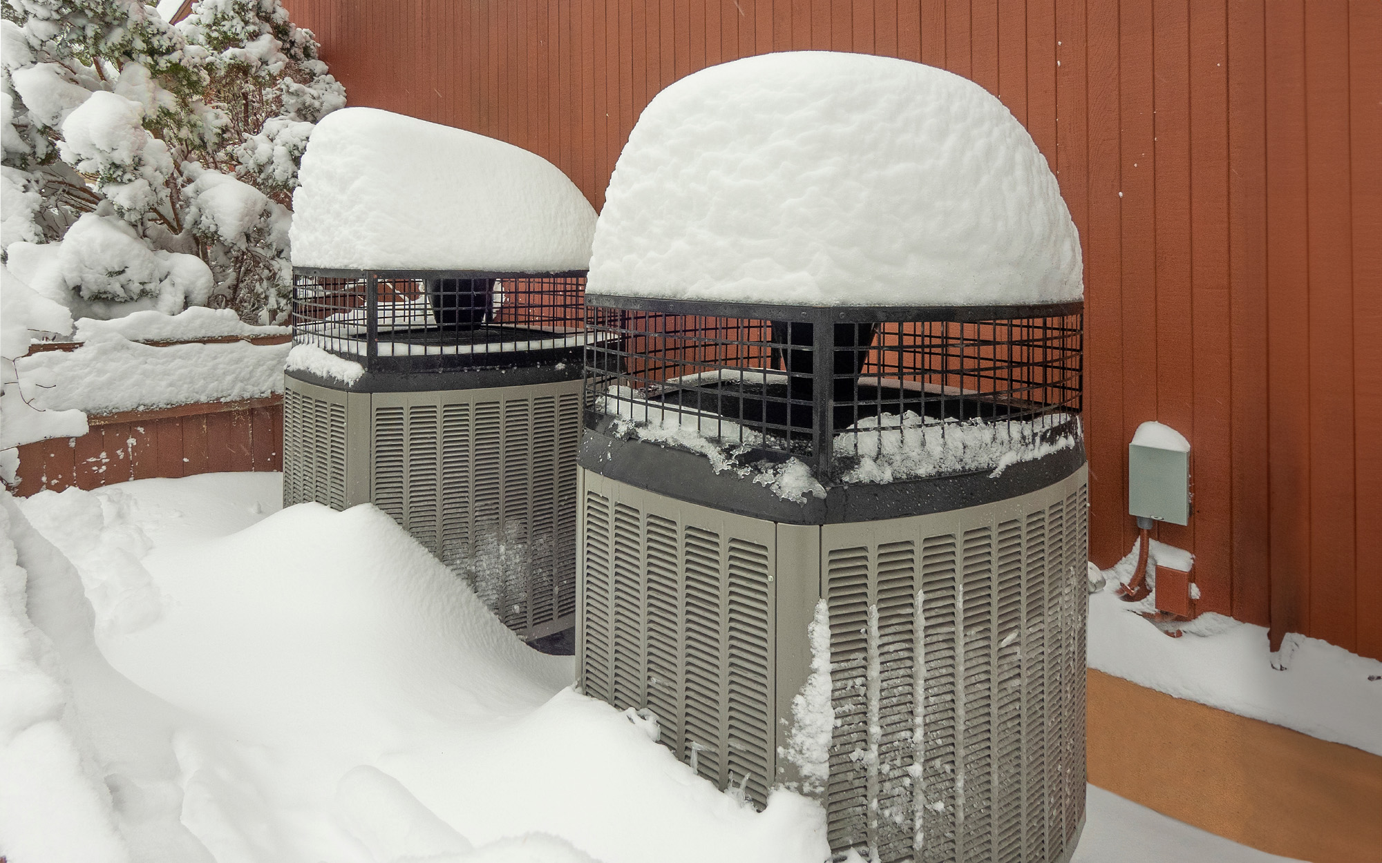 Snow covered heat pumps in winter